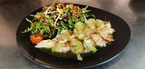 carpaccio de homard , vinaigrette au yusu et sel à la vanille